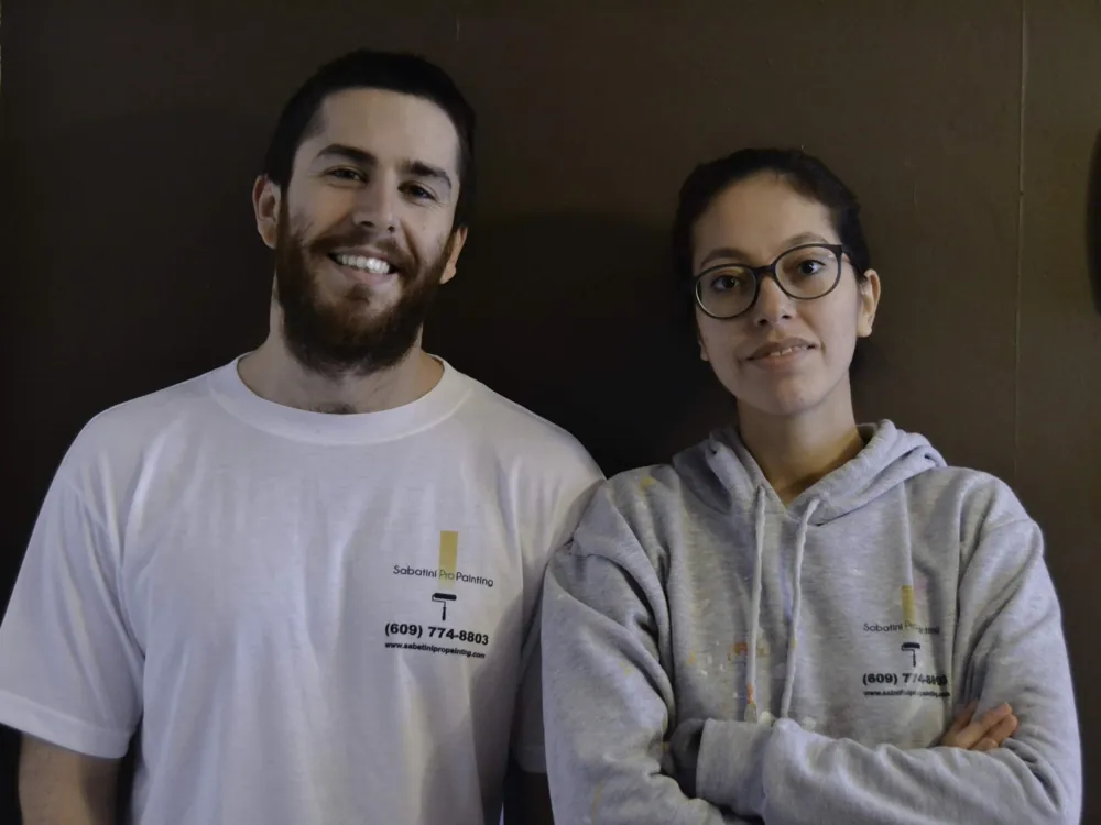 Rick and Alejandra, founders of Sabatini Pro Painting, in their early company shirts
